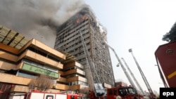 Firefighters battle a blaze that engulfed Iran's oldest high-rise, the 17-storey Plasco building in downtown Tehran, January 19, 2017