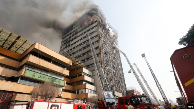 Firefighters battle a blaze that engulfed Iran's oldest high-rise, the 17-storey Plasco building in downtown Tehran, January 19, 2017