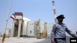 A security officer walks in front of the nuclear power plant in Bushehr, which came online in 2011.