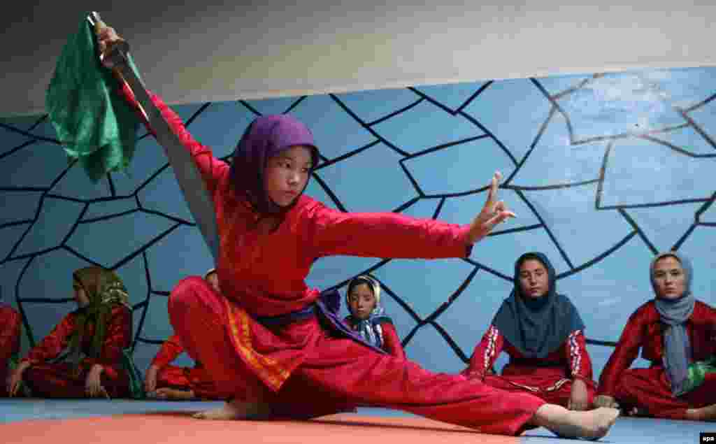 Afghan girls practice martial arts at the Osho Institute in Herat on July 18. (EPA/Jalil Rezayee)