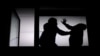 GENERIC -- Silhouette of couple arguing, man beating helpless woman, domestic violence concept, illustration