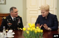 U.S. General Curtis Michael Scaparrotti (left) talks with Lithuanian President Dalia Grybauskaite in Vilnius on March 16.