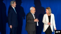 U.S. Secretary of State John Kerry (left to right), Iranian Foreign Minister Mohammad Javad Zarif, and EU foreign-policy chief Federica Mogherini arrive to announce an agreement on Iran nuclear talks in Lausanne, Switzerland, on April 2, 2015.