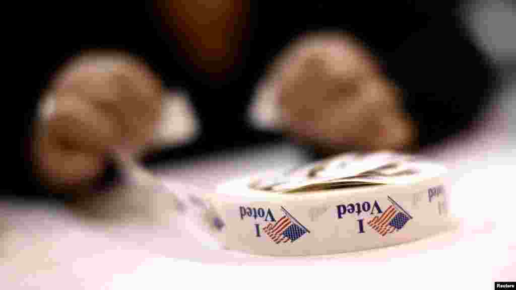 A poll worker prepares &#39;I Voted&#39; stickers at Harrison United Methodist Church in Pineville, North Carolina.