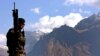 A Turkish soldier patrols along the rugged Turkey-Iraq border.