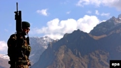 A Turkish soldier patrols along the rugged Turkey-Iraq border.