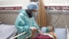 Coronavirus patient with nurse in Iran