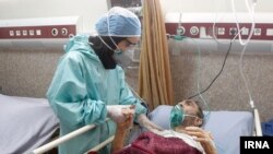 Coronavirus patient with nurse in Iran
