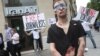 Reporters Without Borders (Reporters Sans Frontieres- RSF) activists take part in a protest in front of an Iran Air agency in Paris, on July 10, 2012. FILE PHOTO