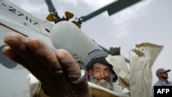 An Afghan villager smiles while welcoming a UN helicopter in the remote eastern hamlet of Gas Ulia (file photo). 