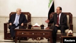 Irački šef diplomatije Nuri al-Maliki i sirijski ministar spoljnih poslova Walid al-Mualem u Bagdadu, maj 2013.