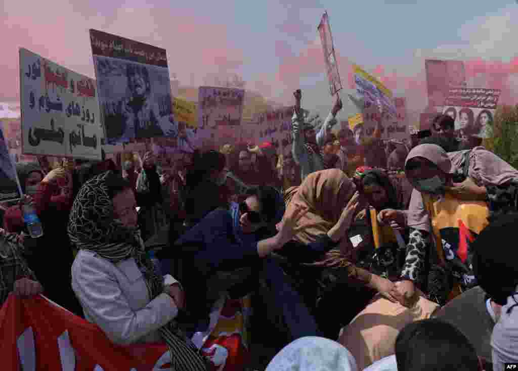 Protesters chant slogans during a protest against Afghan politicians and ahead of Mujahedin Victory Day in Kabul on April 6. (AFP/Shah Marai)