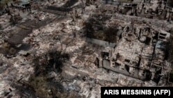 Зруйновані будинки в місті Привіллі на Луганщині внаслідок масштабного вторгнення Росії до України, 14 червня 2022 року