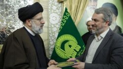 Iran -- Ebrahim Raisi, then-chairman of Astan Quds Razavi, and Seyed Reza Fatemi Amin, undated.