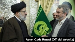 Iran -- Ebrahim Raisi, then-chairman of Astan Quds Razavi, and Seyed Reza Fatemi Amin, undated.