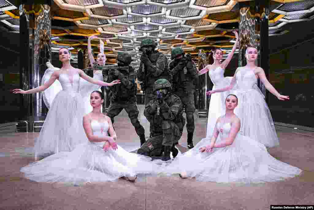 Soldiers and ballerinas pose for pictures during a photo shoot in Yekaterinburg, Russia, to mark International Women&#39;s Day. While International Women&#39;s Day is marked on March 8 across many countries with calls for gender equality, in Russia it is still a holiday largely focused on celebrating outdated gender roles. (Russian Defense Ministry Press Service via AP)