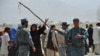 Pashtun nomads talk to Afghan police after confrontations with Hazaras in late August 2010.