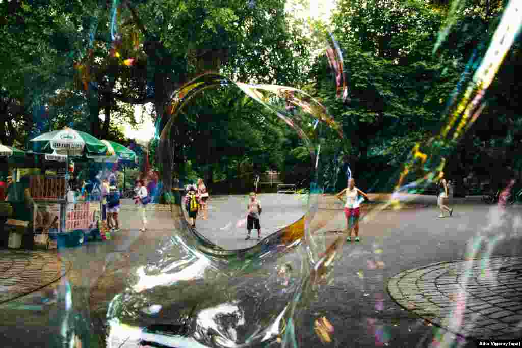 A boy can be seen through a giant soap bubble in Central Park in New York. (epa/Alba Vigaray)