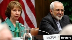 European Union foreign policy chief Catherine Ashton (left) and Iranian Foreign Minister Mohammad Javad Zarif in Vienna on March 18. 