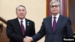 Нұрсұлтан Назарбаев (сол жақта) пен Қасым-Жомарт Тоқаев. Астана, 20 наурыз 2019 жыл.