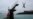 Youngsters jump into the sea from a diving platform in Saint-Malo, northwestern France. (AFP/Valery Hache)