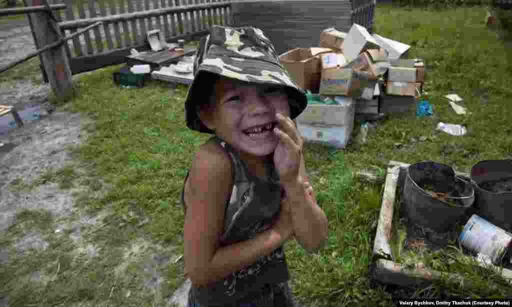 A young boy hams it up for the camera.