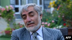 Presidential candidate Abdullah Abdullah claims "industrial-scale" ballot-box stuffing in the runoff election.