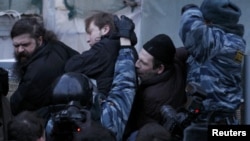 Russian police tussle with participants in an opposition rally in central Moscow on March 5.