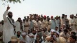 FILE: In the absence of state courts, parties to a conflict often make heated arguments while making their case before a tribal jirga or council. Here, the residents of the town of Bara in the Khyber tribal district debate the fate of minority Sikhs threatened by a fanatical cleric in 2002.