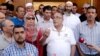 The rector of Lyon's Grand Mosque, Kamel Kabtane (center), has called for government action to counter the fear of Muslims.