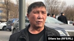 Nurzhan Mukhammedov attends a demonstration in front of the Shymkent city police department in December 2019.