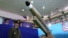 IRAN -- Iranian Defense Minister Amir Hatami stands next to a new generation of Iranian short-range missile 'Fateh-mobin' during an unveiling ceremony in Tehran, August 13, 2018