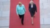 Theresa May caută să „vândă" Brexit în Germania și Franța