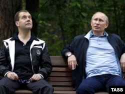 Are President Dmitry Medvedev (left) and Prime Minister Vladimir Putin engaged in political theater?