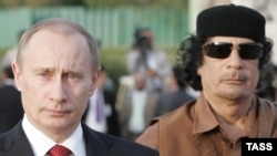 Then Russian President Vladimir Putin (left) and Libyan leader Muammar Qaddafi at Qaddafi's residence within the Bab al-Aziziya barracks in Tripoli in April 2008