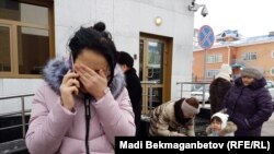 Aqmaral Akhmetova reacts outside the Kazakh Prosecutor-General's Office after the death of her mother Maira Rysmanova in Astana on December 14