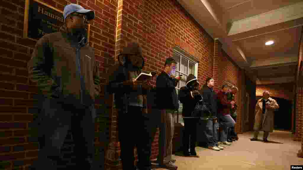 Voters stand in line before the polls open at Harrison United Methodist Church in Pineville, North Carolina.