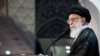 Iranian Supreme Leader Ayatollah Ali Khamenei delivers a speech after the Id Fitr prayers at the Imam Khomeini grand mosque in Tehran on June 26