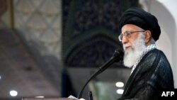 Iranian Supreme Leader Ayatollah Ali Khamenei delivers a speech after the Id Fitr prayers at the Imam Khomeini grand mosque in Tehran on June 26