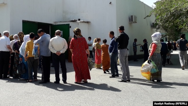 Ashgabat residents queue for food earlier this month.