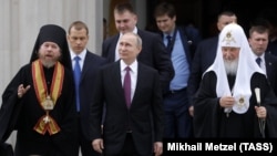 Митрополит Тихон (Шевкунов), президент России Владимир Путин и патриарх Кирилл (архивное фото)