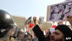 Protesters holding up anti-Saudi signs rally in front of the Saudi Embassy in Tehran in March, following Saudi assistance to a crackdown on Shi'ite protesters in Bahrain. Could sectarian tensions be raised as part of a Saudi-Iran proxy clash?