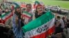 Iranian women watch a soccer match at Azadi Stadium in Tehran in 2018, one of the rare times they were allowed inside a stadium while men competed.