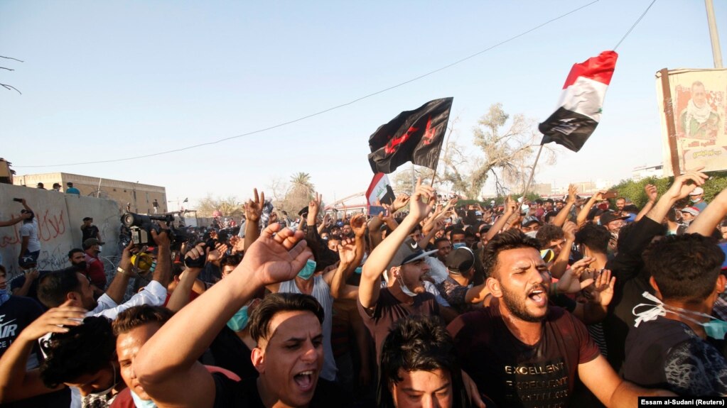 People gather during a protest near the building of government office in Basra, Iraq September 6, 2018.