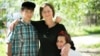 Валентина Шитикова, патронатная мать, с Артемом и Кристиной, которых взяла в свою семью. Алматы, 4 июня 2016 года.