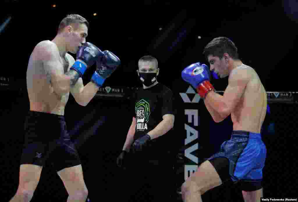 Belarusian fighters Yevgeniy Fedorinchik takes on Dmitry Filippov during the Belarusian Fight Championship at Prime Hall in Minsk on April 17.
