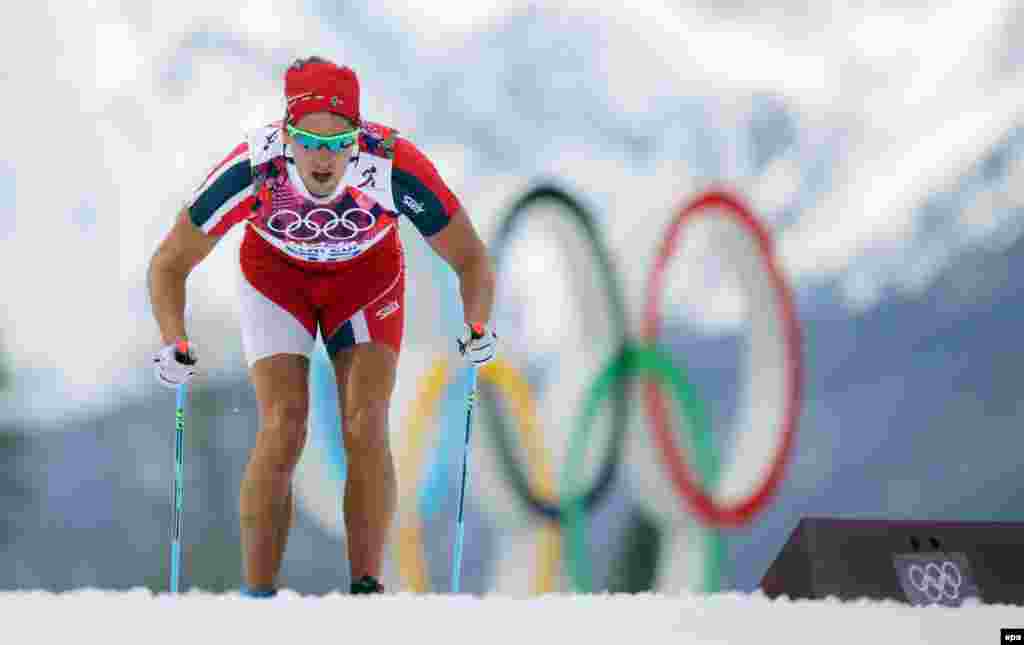 With temperatures climbing as high as the medal counts, Norway's Chris Andre Jespersen competes in improvised shorts and short sleeves during the men's 15-kilometer classic cross-country event. (EPA/Kay Nietfeld)