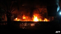 A vehicle burns after it was set on fire inside the U.S. Consulate compound in Benghazi, Libya, on September 11.