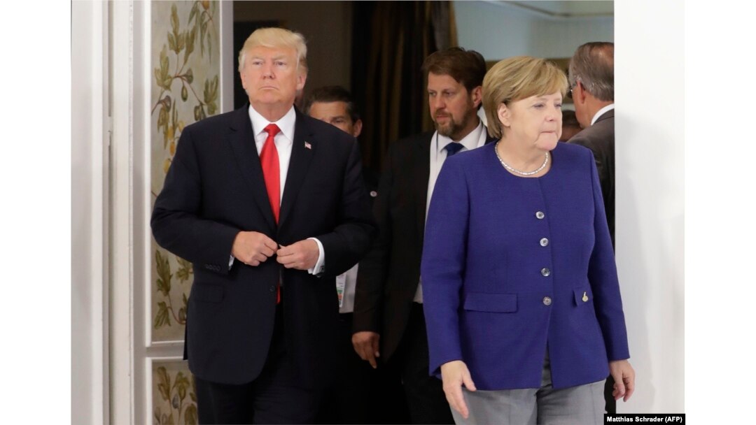 Дональд Трамп и Ангела Меркель во время встречи накануне начала саммита "Большой двадцатки"