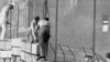 Germany - East German workers raise the height of the Berlin wall to stop West and East Berliners from waving to each other or taking up any other forms of contact, on 01Oct1961, under surveillance of East German soldiers.